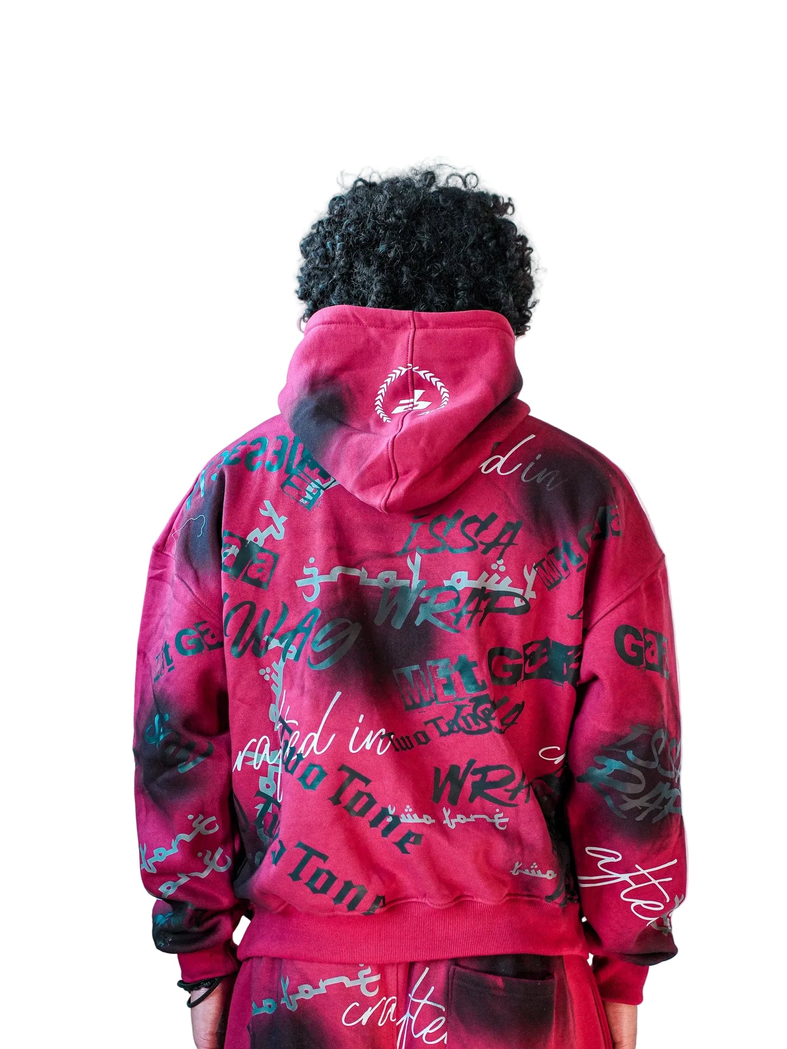 Person wearing a red hoodie with black text design on the back against a plain background